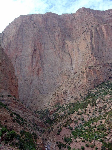 "La Bas (5.12b) climbs the buttress just to the right of the prominent recess in the center of the cliff."