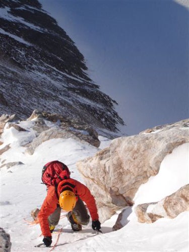 Jed Brown climbing on the upper West Fa Jed Brown climbing on the upper West Face of Mt. Anderson.