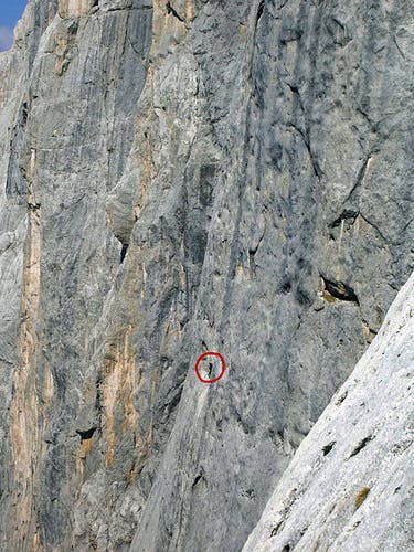 Hansjörg Auer free-soloing Via Att Hansjörg Auer free-soloing Via Attraverso il Pesce (33 ptiches, 5.12c) on the Marmolada, as seen from the nearby route Don Quixote.