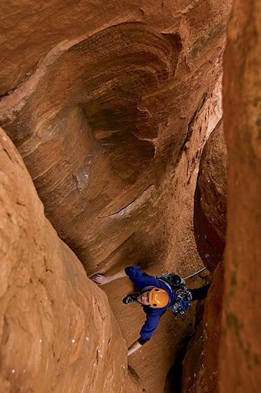 The Mace (III 5.9+), often called stout The Mace (III 5.9+), often called stout for the grade by desert neophytes, climbs cracks and chimneys on the flip side of the tower, before the…