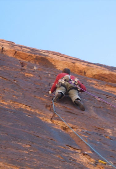 Mike Anderson leads the Black Pitch (5. Mike Anderson leads the Black Pitch (5.11, pitch seven) on Shake That Bear (5.12d R), Mt. Kinesava, Zion National Park. Photo by Rob Pizem.