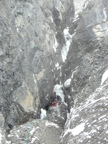 Pierre Darbellay in the thick of it, in Pierre Darbellay in the thick of it, in deteriorating weather, on The Dogleg Couloir of Mt. Chephren. Photo by Raphael Slawinski.
