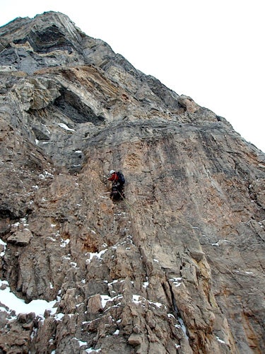 Raphael Slawinski starts the crux headw Raphael Slawinski starts the crux headwall of the Greenwood-Jones Route (M6 in winter) on Mt. Temple. The route climbs into the prominent corner at…