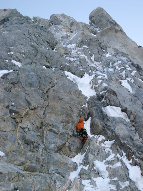 Freddie Wilkinson leads snowy rock on t Freddie Wilkinson leads snowy rock on the south face of Bat's Ears. Photo by Ben Gilmore.