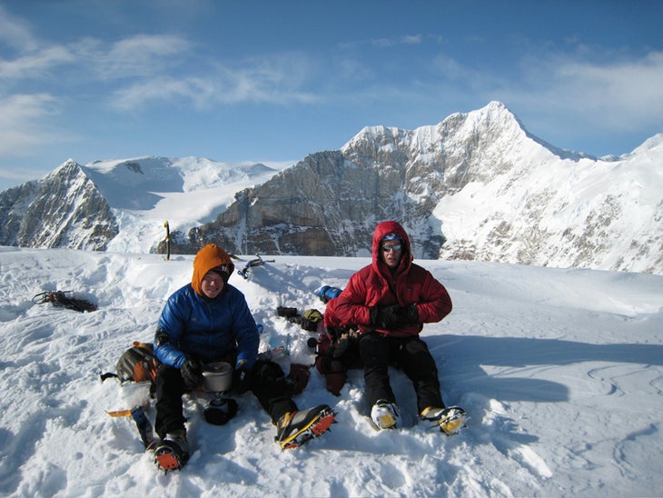 Freddie Wilkinson (left) and Max Turgeo Freddie Wilkinson (left) and Max Turgeon brew up on the summit of Bat's Ears after the first ascent. Behind them is the south face of the Fin.…