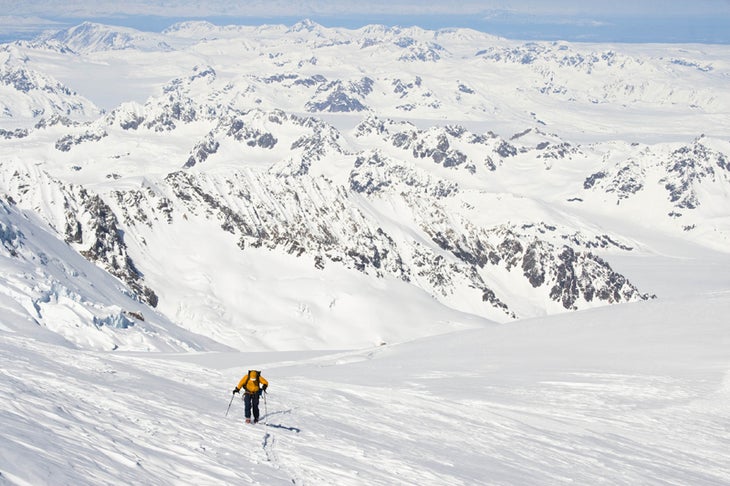 Andrew Wexler near the summit of Mt. Sp Andrew Wexler near the summit of Mt. Spurr (11,069 feet), above the smaller peaks surrounding the lower Capps and Triumvirate glaciers. Central…