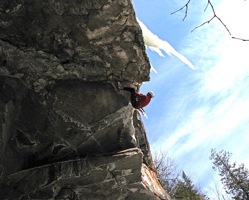 Josh Hurst nearly across the big cave on Silent Spring (M12) in western Maine. Photo by Ian Austin.