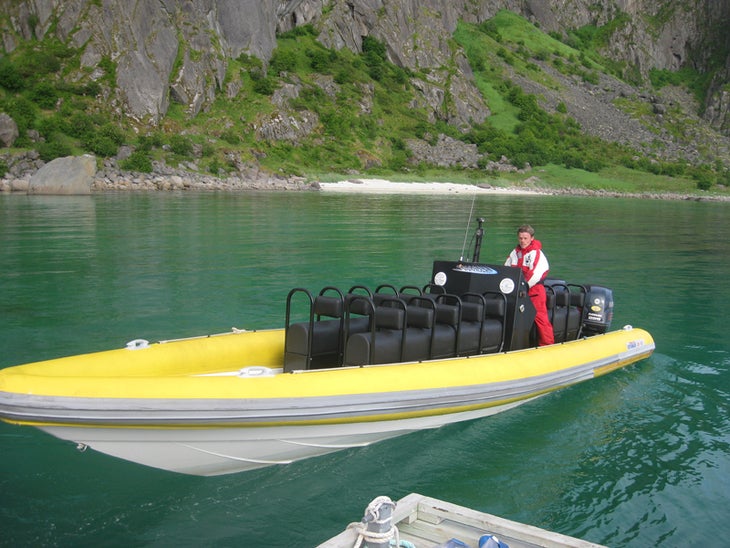 One of the speedy boats for moving tour One of the speedy boats for moving tourists around the islands. Photo by Rob Pizem