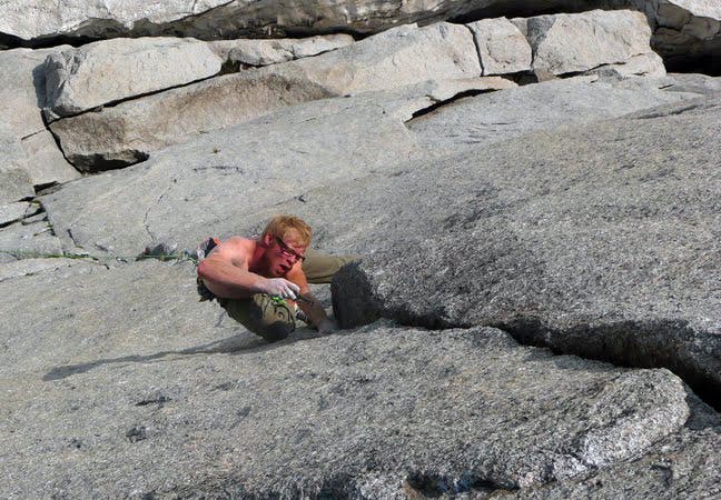 Jason Kruk suffering in the high-alpine Jason Kruk suffering in the high-alpine environment on the crux pitch of Sendero Norte. Jason Kruk Collection / http://www.JasonKruk.net.