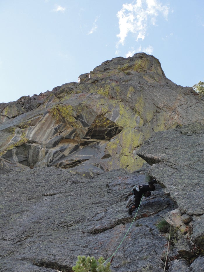 Joel stems out the steep and deep corne Joel stems out the steep and deep corner on pitch 5. Photo by Mark Givens