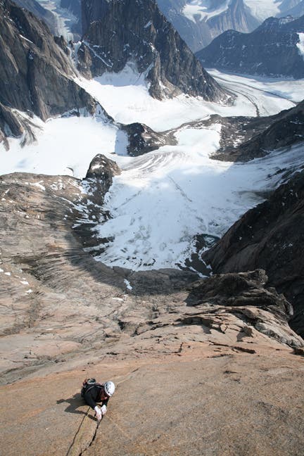 Jon Walsh climbing on the south face of Mt. Asgard, possibly making the first free ascent of the South Tower. Photo by Chris Brazeau.