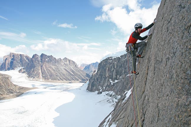 Walsh climbing on Stories in Stone (5.1 Walsh climbing on Stories in Stone (5.12- A0, 600m), Mt. Walle. Photo by Chris Brazeau.