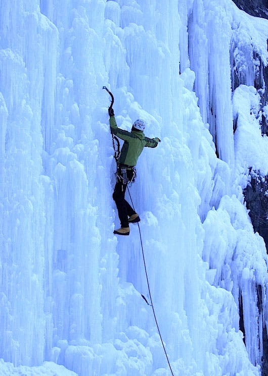Erik Schnack climbing the first ascent Erik Schnack climbing the first ascent of Carlsberg Column in down booties. Photo courtesy of Jovan Simic