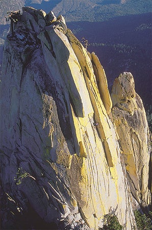 225- Kennan Harvey_2221.jpg With a Slight of Hand (5.10b), Cheryl Albrect mounts the Sorcerer's Needle. Needles, CA © Photo by Kennan Harvey