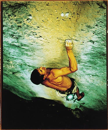 227- Bobby Model_2228.jpg Matt Wendling gets intimate with his route Sky Pilot (5.14a), Tensleep, WY © Photo by Bobby Model