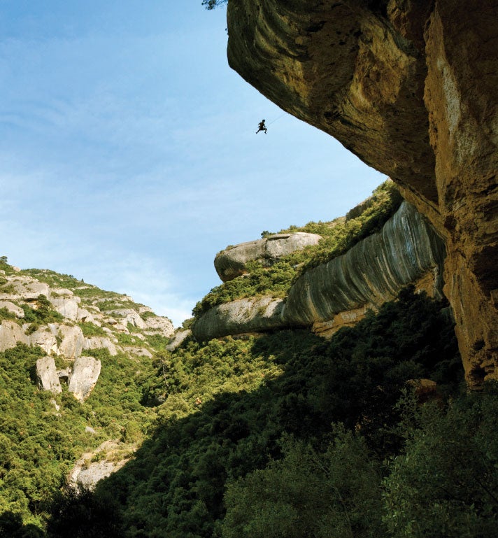 Chris Sharma taking a ride off the top Chris Sharma taking a ride off the top of Era Bella in Spain. Photo by Boone Speed