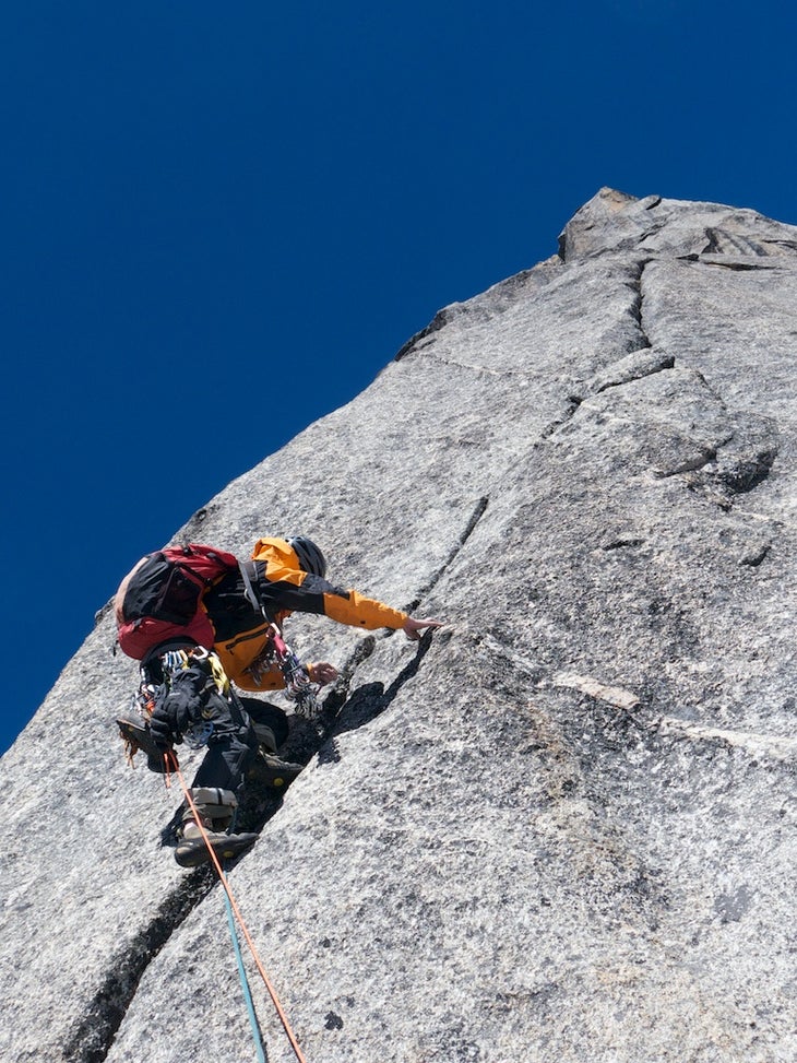 DEA 61949 Dave Anderson leading beautiful granite during the first ascent of Mt. Dayantianwo in China.
