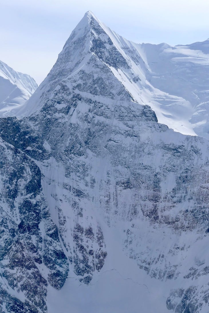 389 The northwest face of Deborah. The 2,000-meter route climbed the ride side of the pyramidal face, then followed the northwest ridge to the summit.…