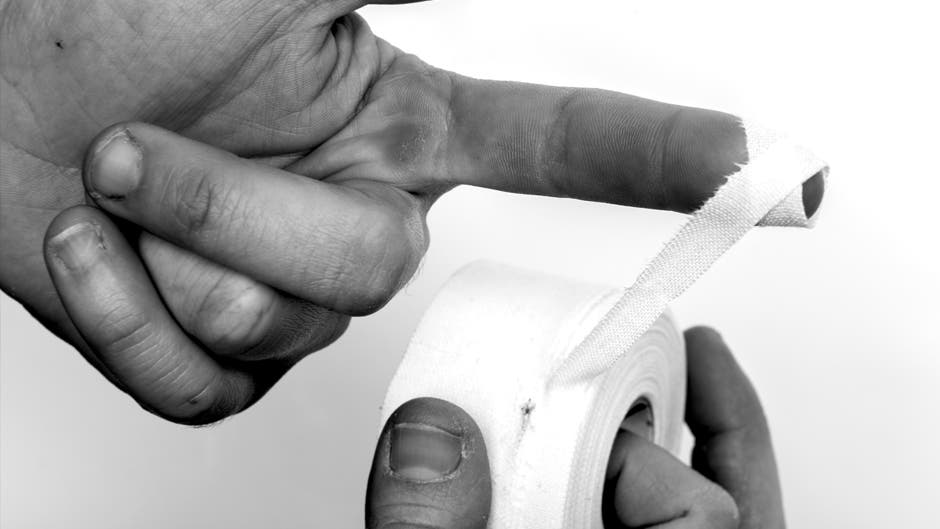 PromoSkinCare.jpg Taping fingers for rock climbing.
