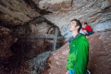Tom Randall watches the rain waterfall out of Lamb of God