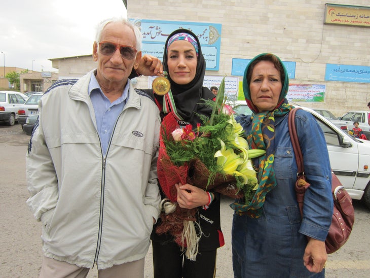 Asian Gold medal 2013. with mum and dad. photo by Farshad Esmaeilzadeh_gn-web Farnaz Esmaeilzadeh Speed Climbing Asian Championship Medal