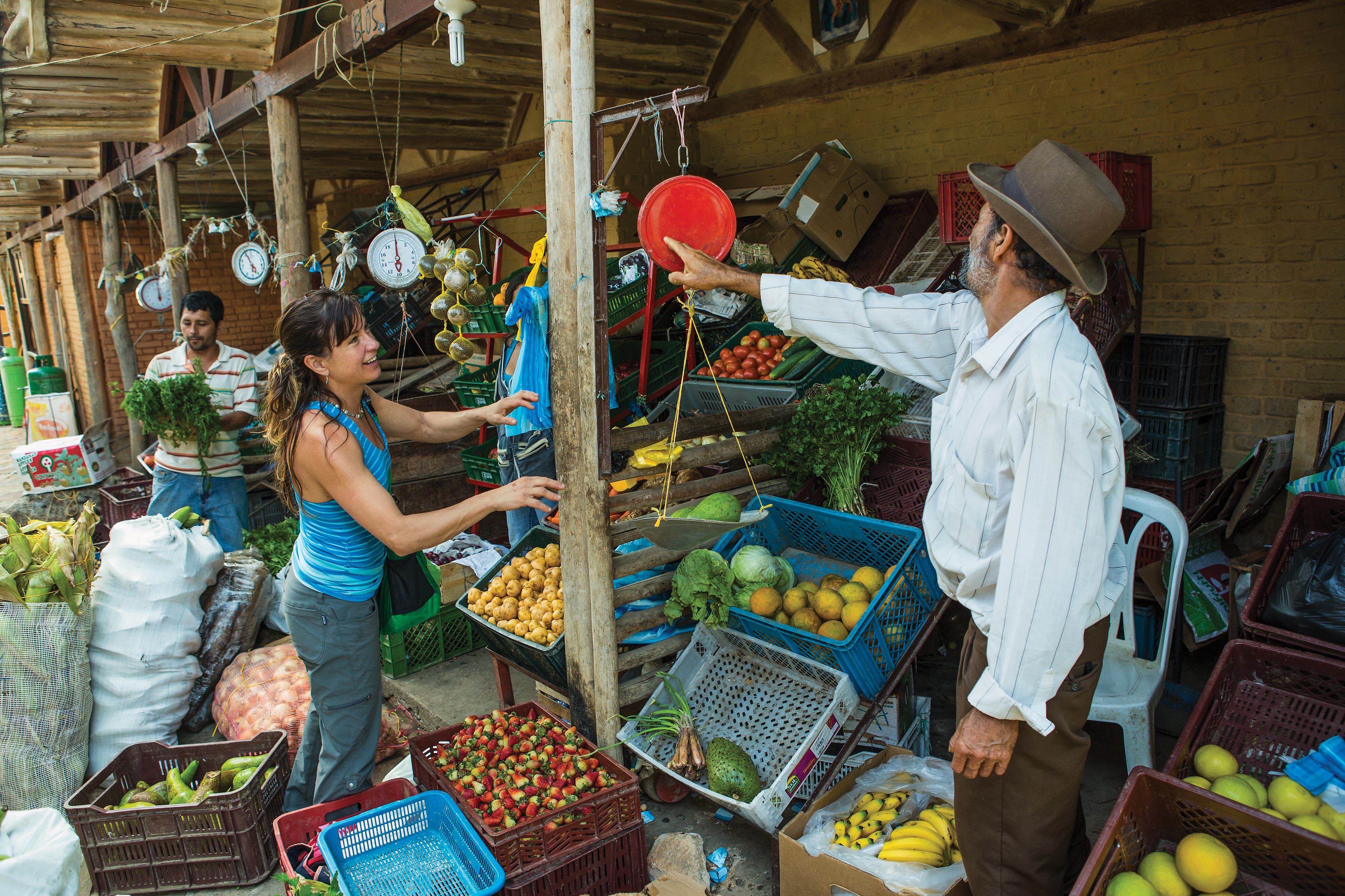 Buying produce at the farmer’s market in Mesa De Los Santos, Colombia.