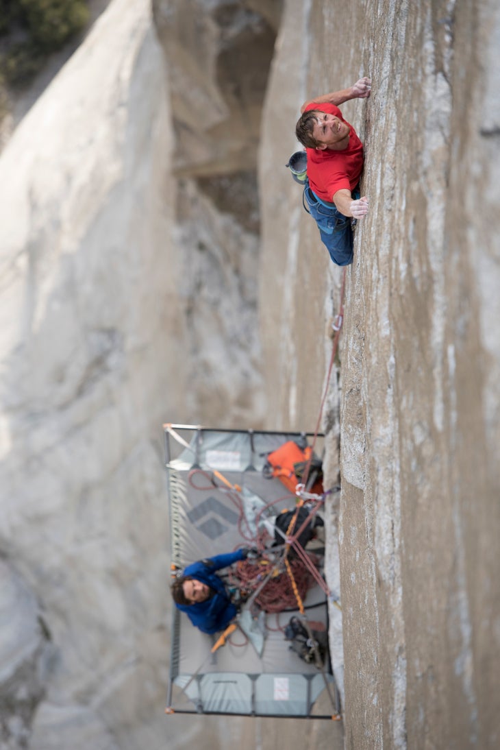 Action_Tommy_3(c)CoreyRich_DawnWall Tommy Caldwell climbs while Kevin Jorgeson belays from the portaledge below.