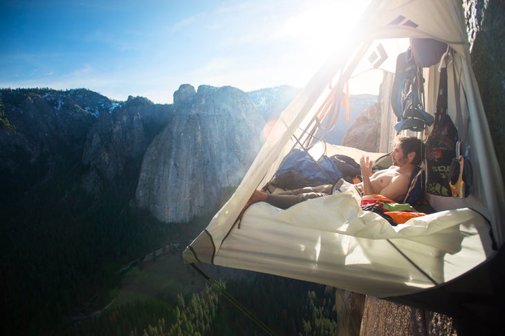 Lifestyle_Kevin Jorgeson resting in portaledge_(c)CoreyRich_DawnWall Kevin Jorgeson sits in the portaledge tent in a moment of peace
