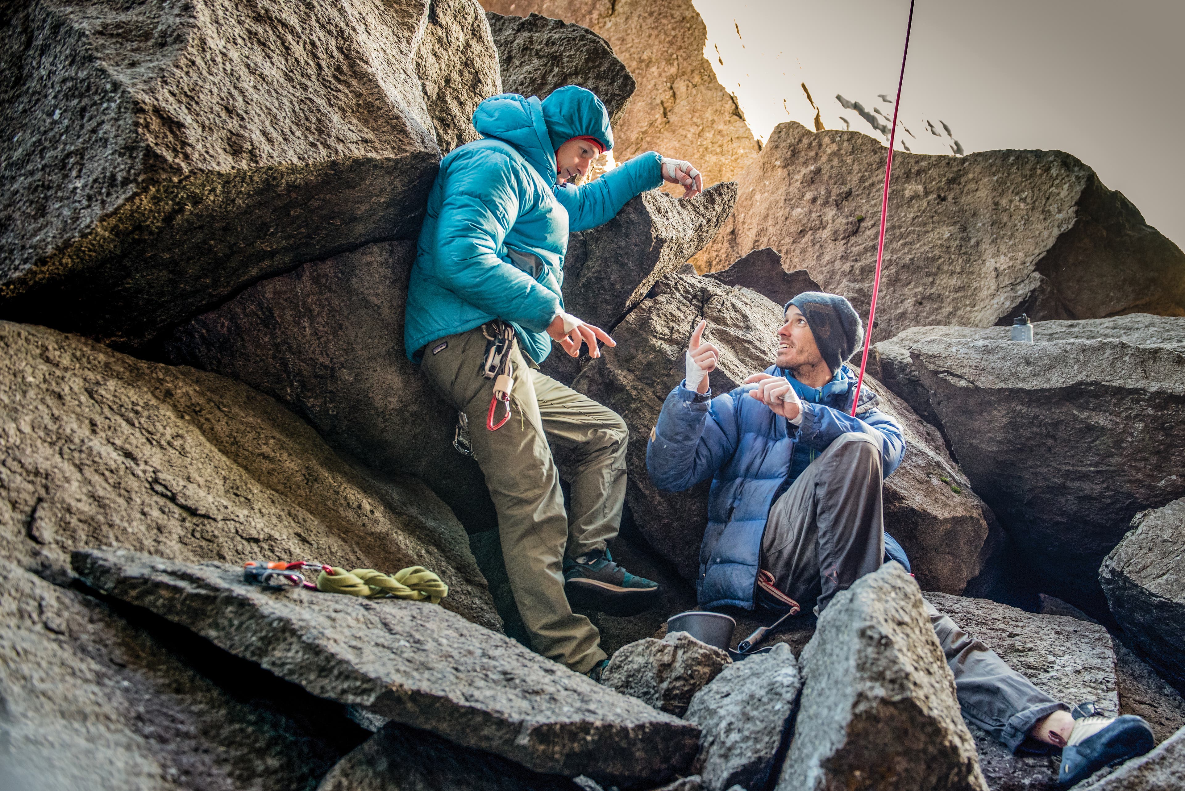 TristanHobson_6926_gn-web Two men resting among jagged boulders