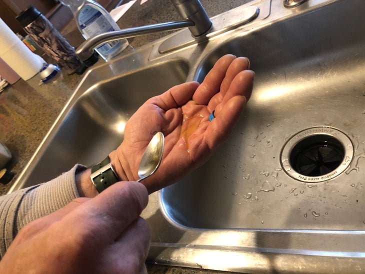 Olive oil and hand.