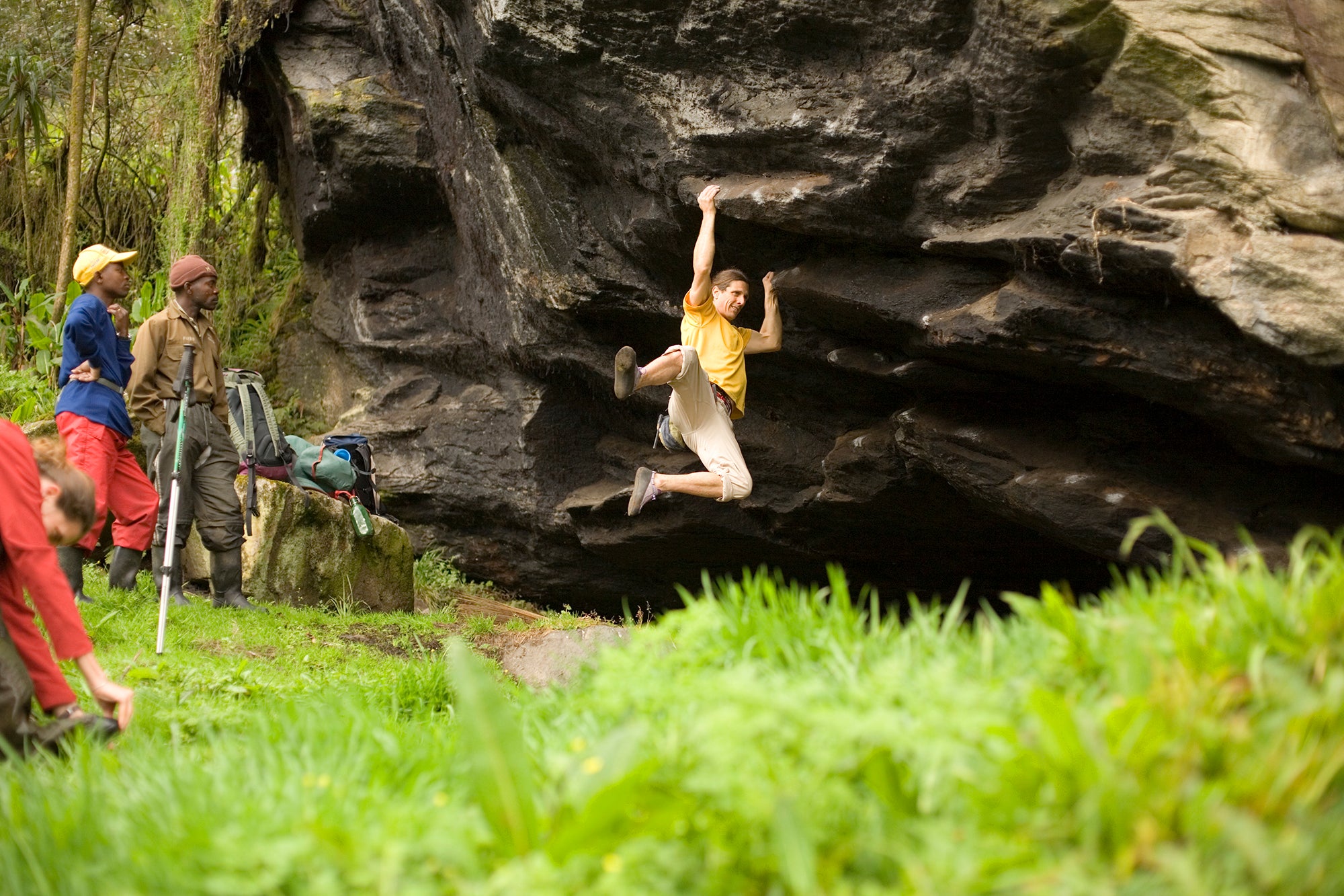 Jeff Jackson pulls on some virgin rock in the Rwenzori Range Uganda, Africa.