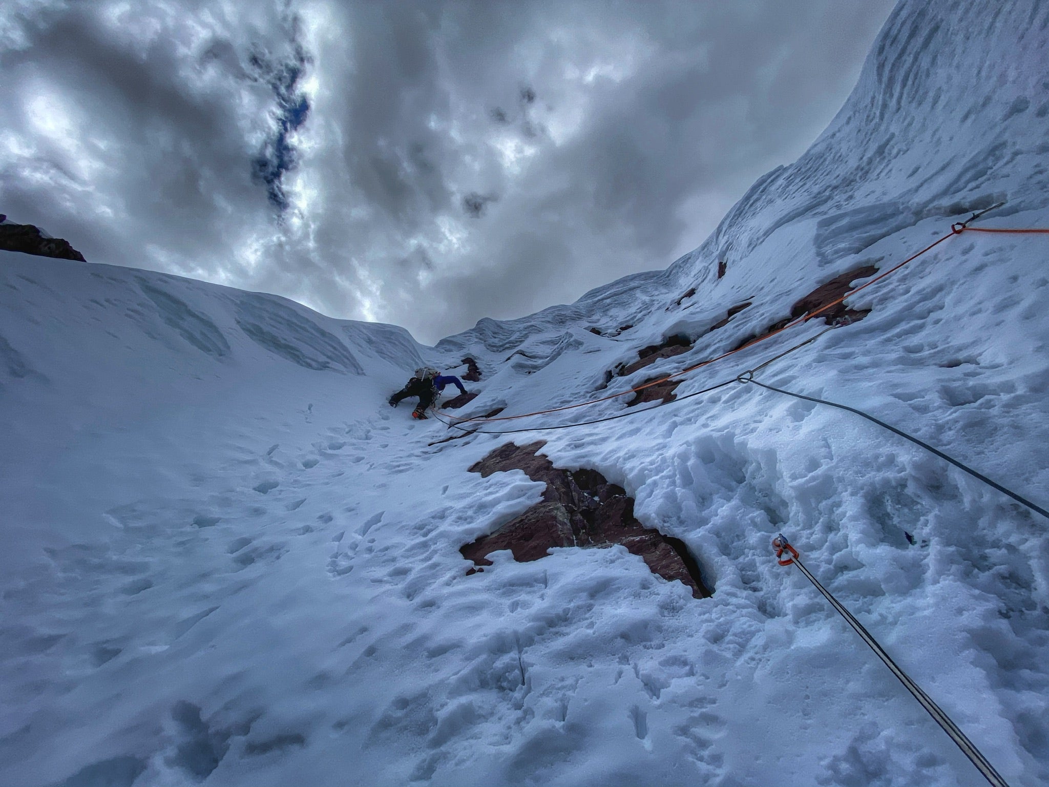 Alpine climber Alex Torres climbs a pitch of steep snow in Peru