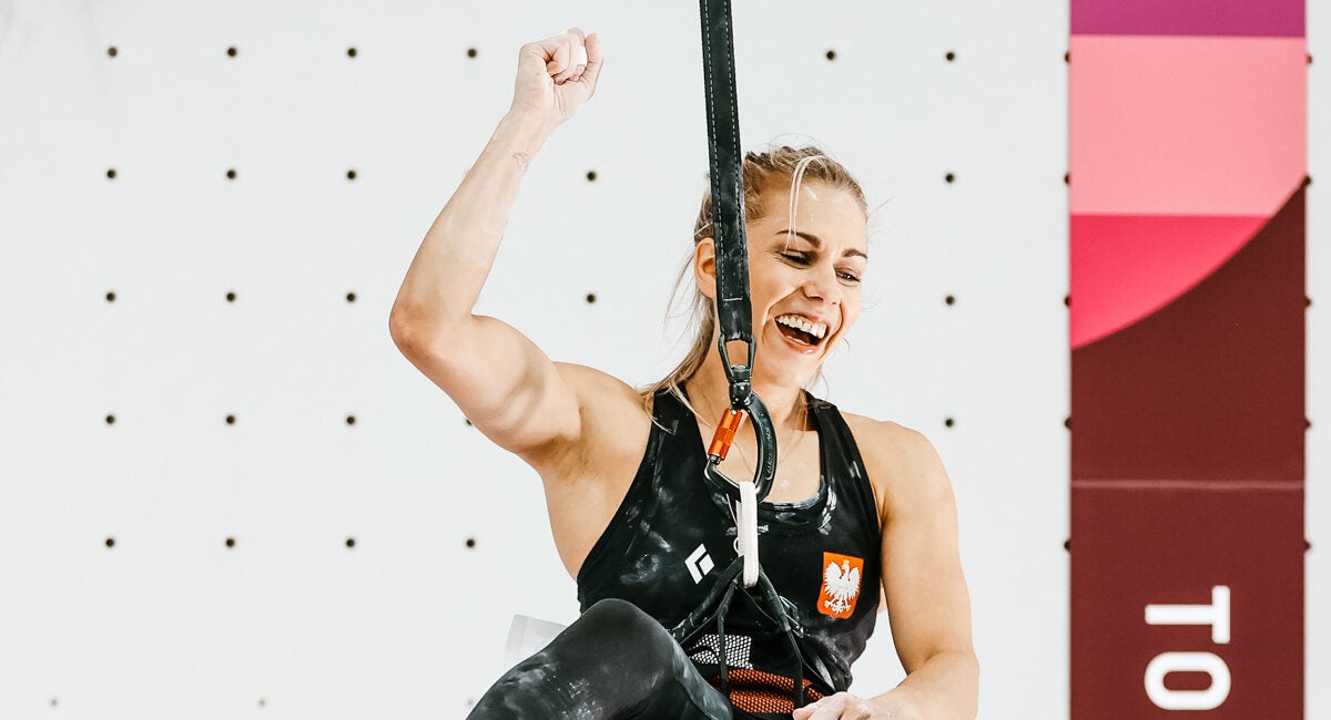 Aleksandra Miroslaw of Poland celebrating after posting a new world record in women's speed climbing