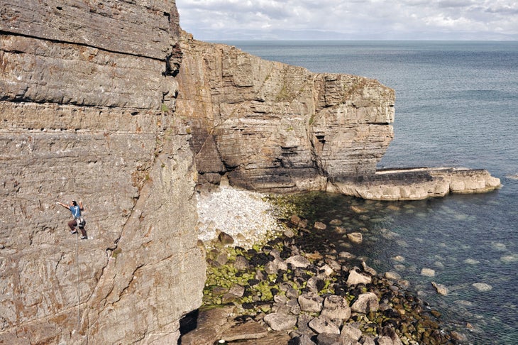 A climber on a sea cliff in North Wales