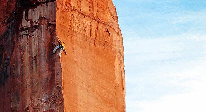 Climber on The Priest formation, Castle Valley, Utah.