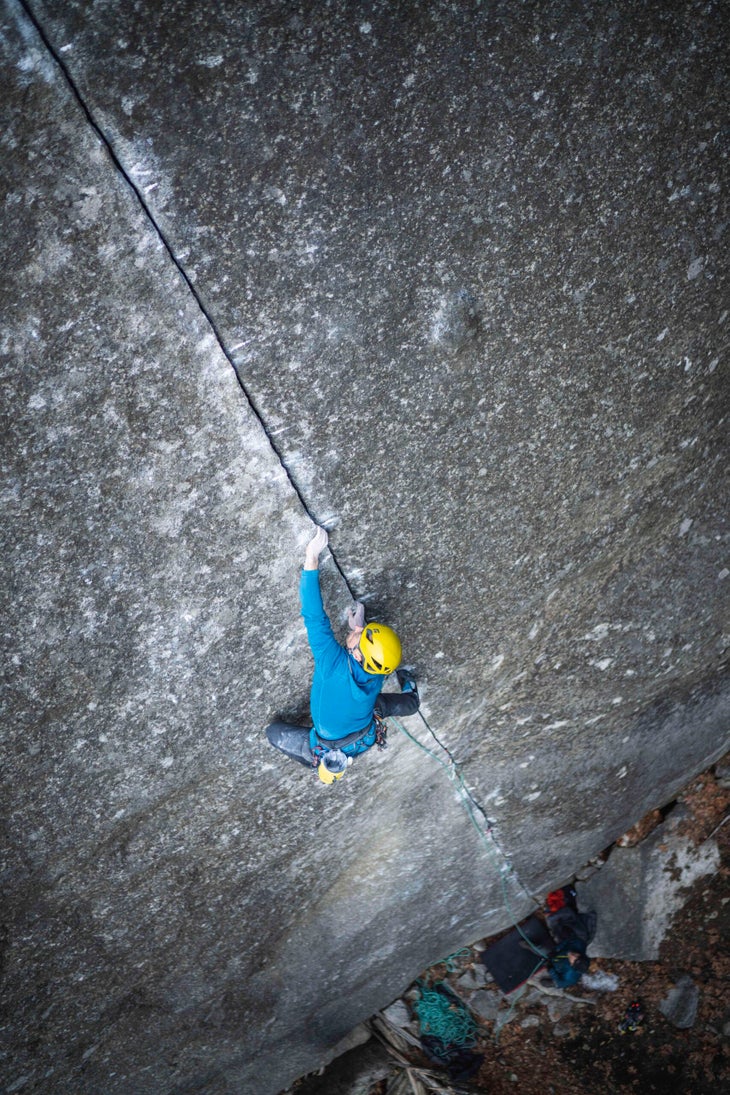 Man climbs rock face in California.