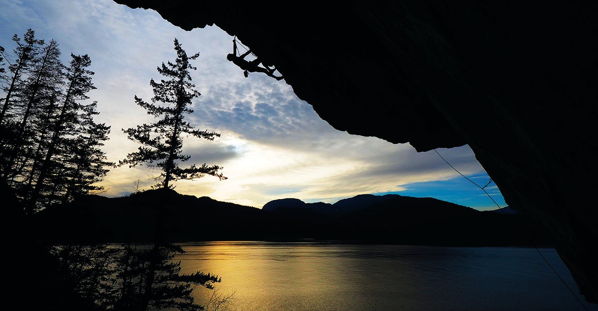 Apnea (5.14) is currently the most difficult—and steepest—line at the Dragon’s Lair on Anvil Island, Howe Sound, British Columbia, moving through multiple massive roofs along its 115 feet; the climb overhangs 40 feet in 18 bolts. Apnea took Tim Emmett, shown here at sunset, several years of effort to establish—“especially considering most of it was done paddleboarding from Porteau Cove, six miles each way,” he says. The route’s crux (V9) is at the bottom, featuring, says Emmett, “a feisty pull off a flared finger jam for a tiny crimp with the right hand”—followed by a boatload of steep, hard climbing above, up a hanging wall and onto a rowdy arête.