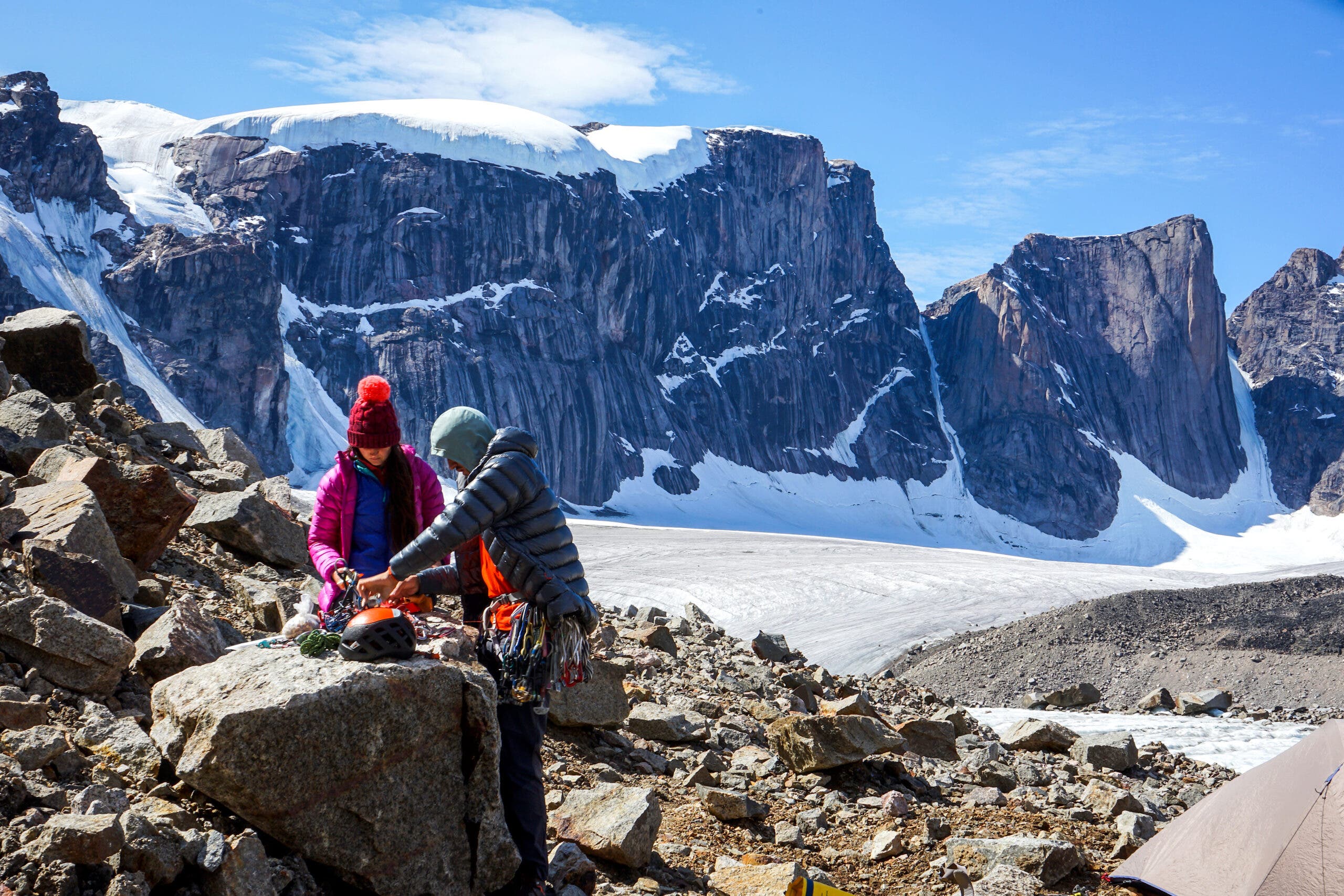 Climbers Bronwyn Hodgins and Jacob Cook sort gear on Baffin Island