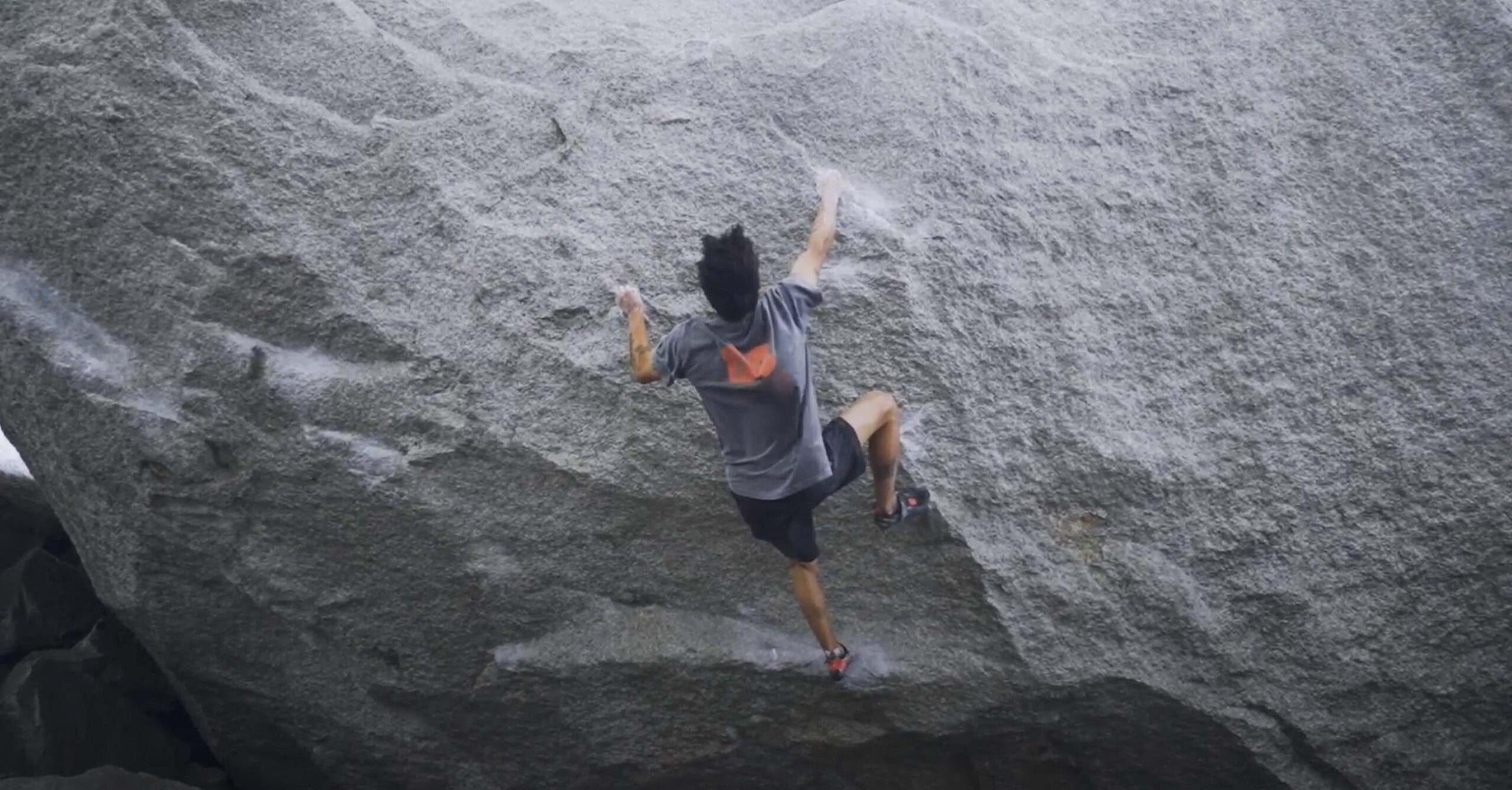 Uchida sending Singularity. He's already stuck the crux cross move and is on the last hard move, a dyno to a good edge.