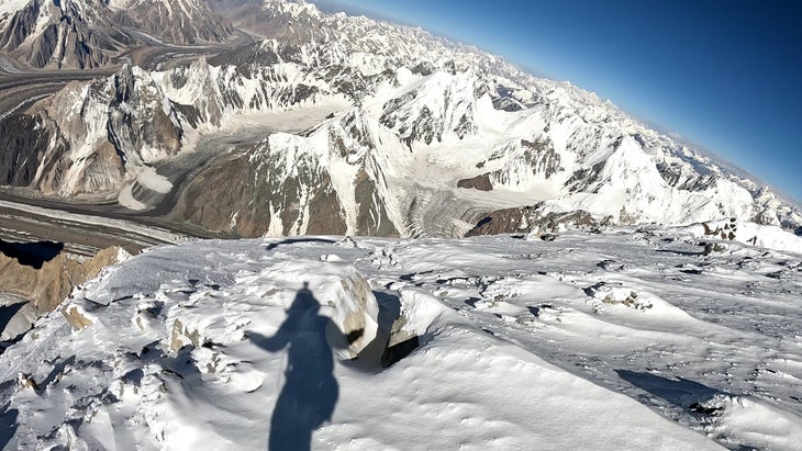 Benjamin Védrines paraglides off the summit of Broad Peak.