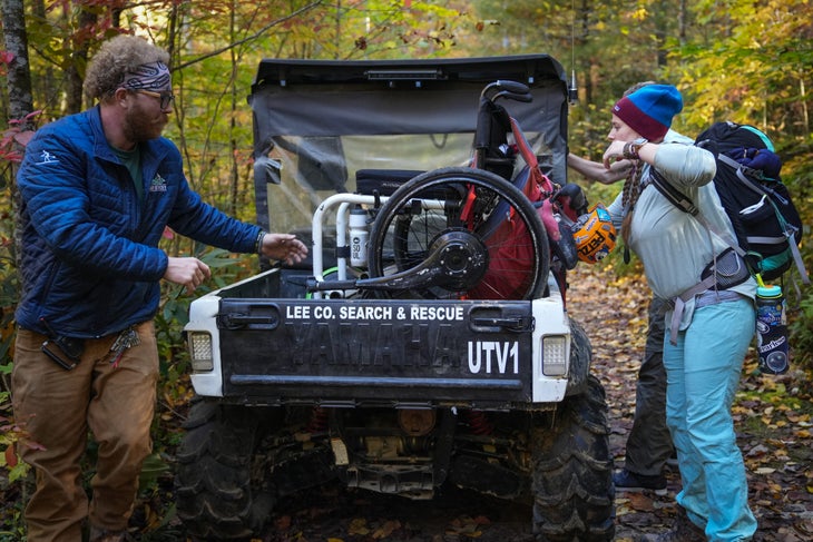 Adaptive Climbers Festival volunteer Erin Potter (right) unloads a participant’s wheelchair with the help of Lee County Search and Rescue Volunteer Zane Paff in Muir Valley.