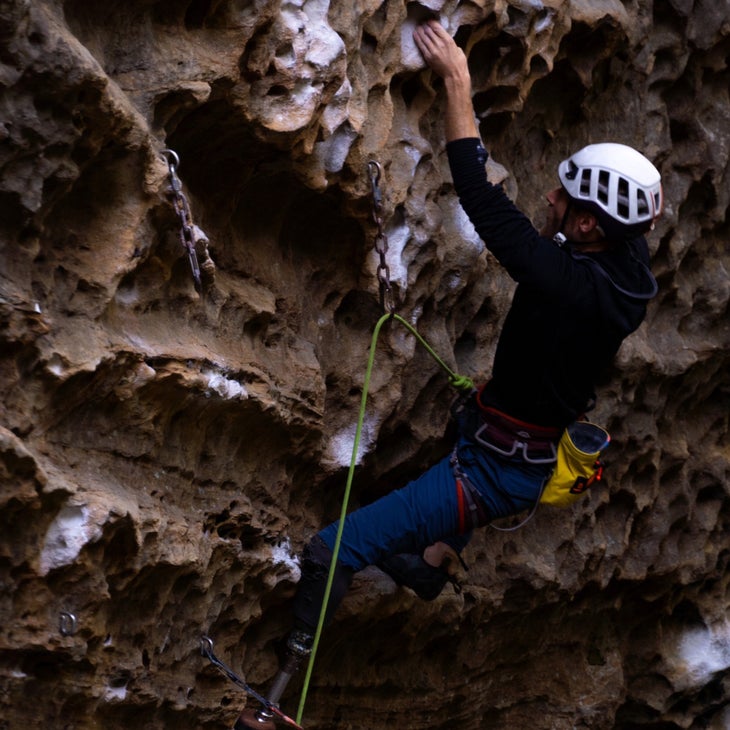 Jono Lewis climbing