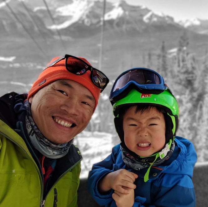 Larry Shiu rides a gondola with his son Leo.
