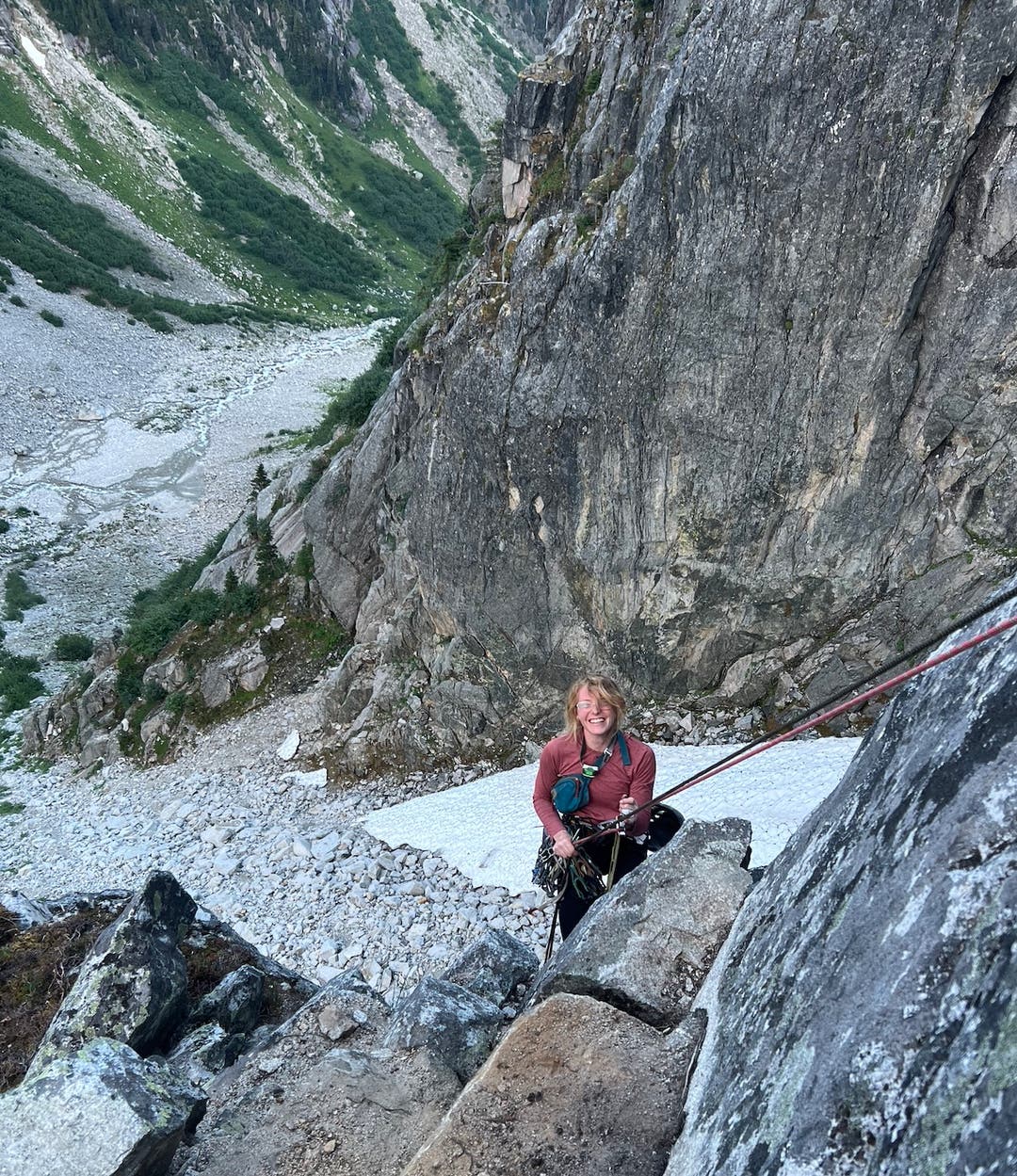 Cassy Doolittle rappels down steep granite face.