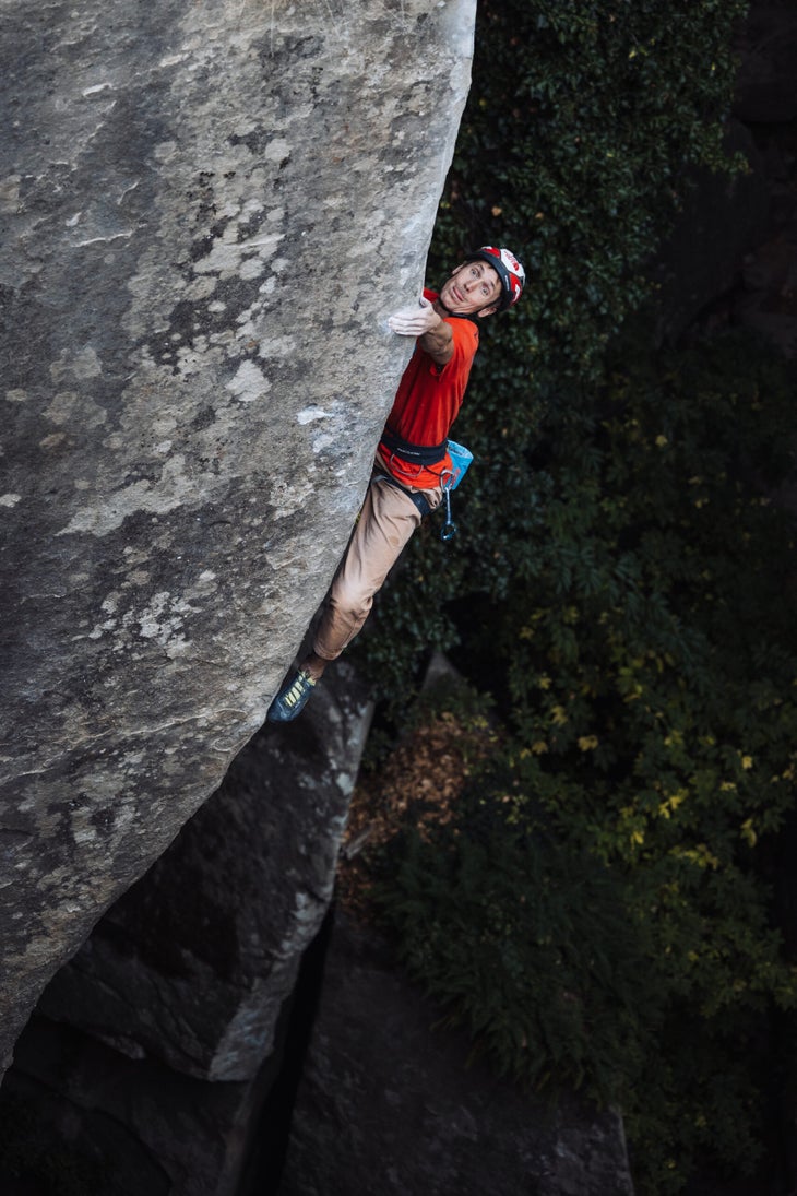 Pearson climbing a technical arete.