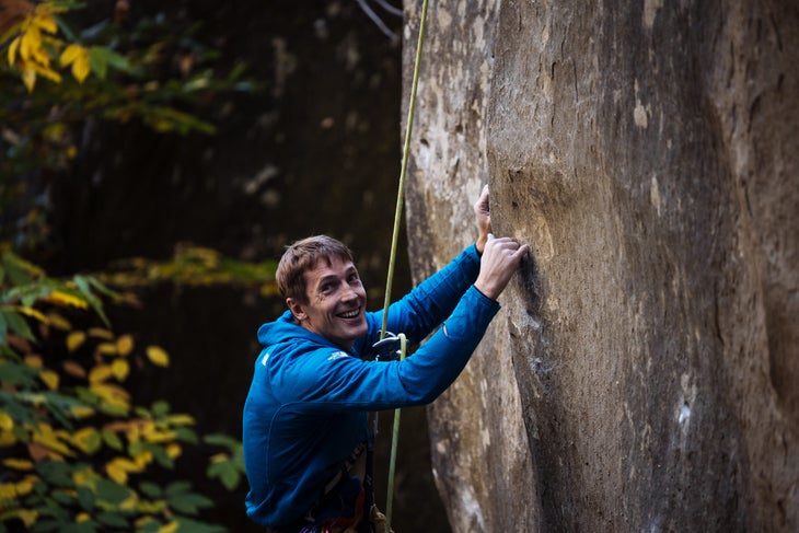 Pearson, hanging on a rope, smiling