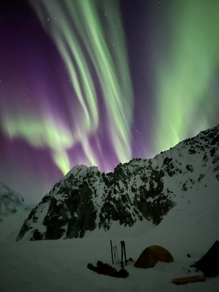Purple and neon aurora borealis above Mt Huntington, AK.