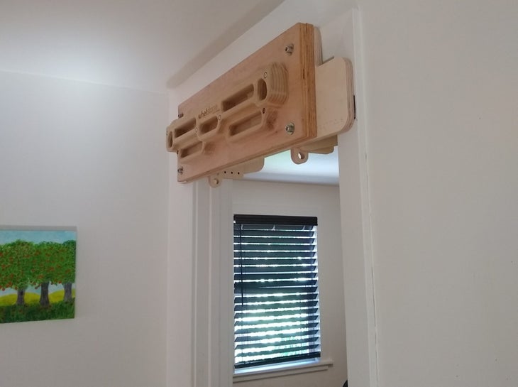 A hangboard in a doorway