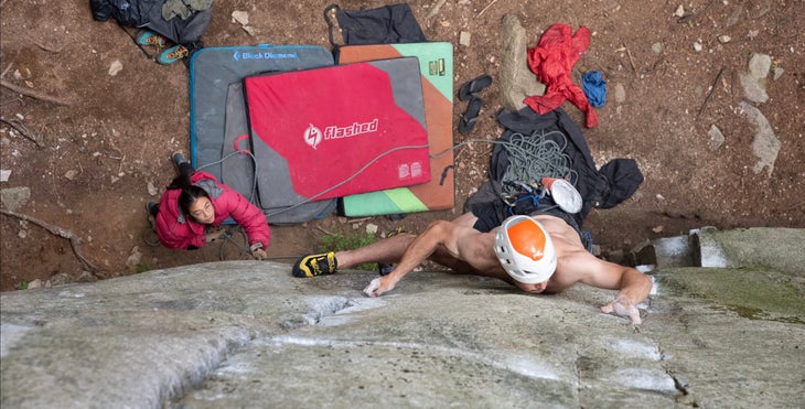 Wearing a helmet and Miura VS's, Digital Editor Anthony Walsh climbs The Masses are Asses, a polished granite 5.12. He's padded the base of the route with bouldering pads in case he pulls his gear.