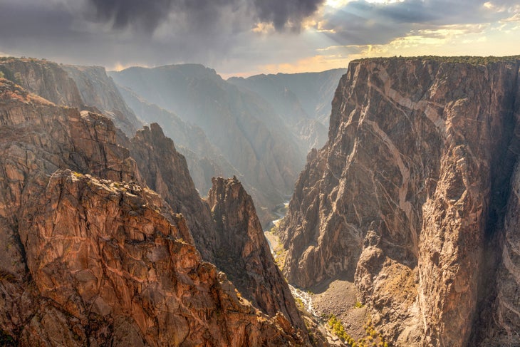 Looking at the steep Painted Wall in the Black Canyon of Gunnison at sunset.